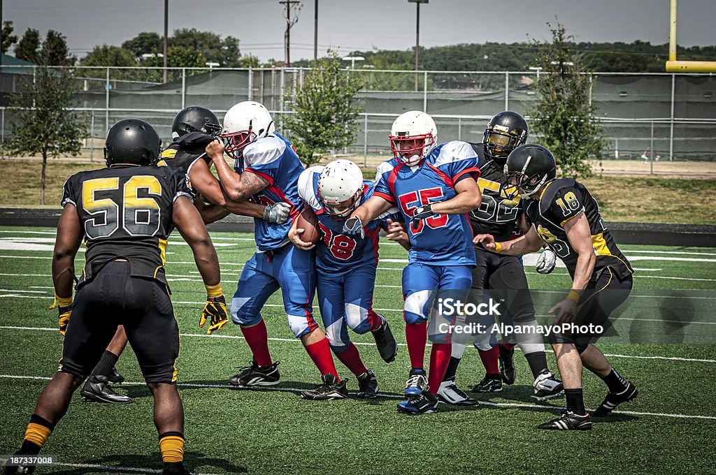 Gioco in corso-V - Foto stock royalty-free di Football americano universitario