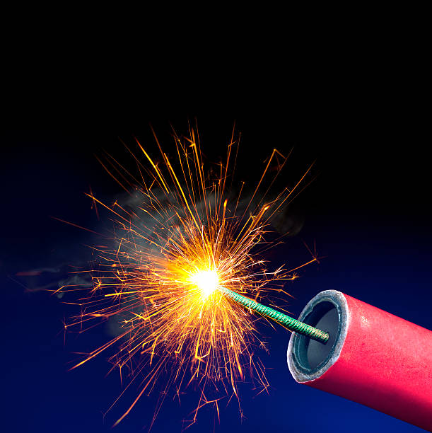 Fireworks or Explosives, Sparkling Lit Fuse, Copy Space Fireworks or Explosives, Sparkling Lit Fuse, Copy Space firework explosive material photos stock pictures, royalty-free photos & images