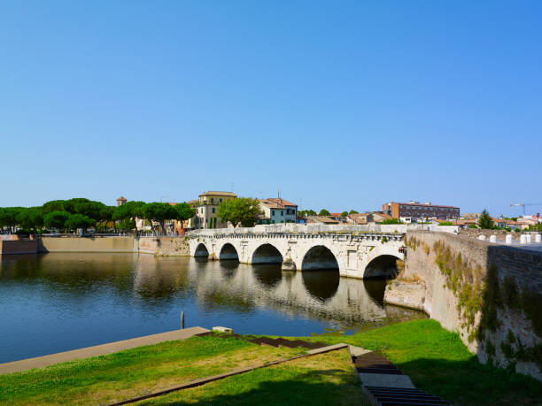 istock Tiberius bridge in Rimini on a background of blue sky 1873380320