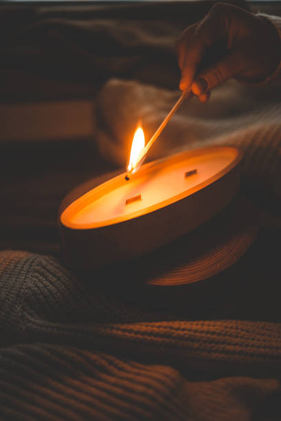 istock A match lights a candle in wood 1873382410