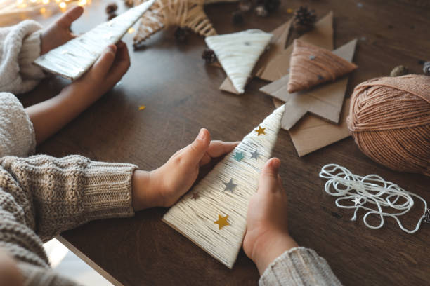 istock Children making Christmas decorations from yarn 1873383989