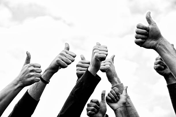istock Group of People Thumbs Up Outdoors.Black And White 187338737