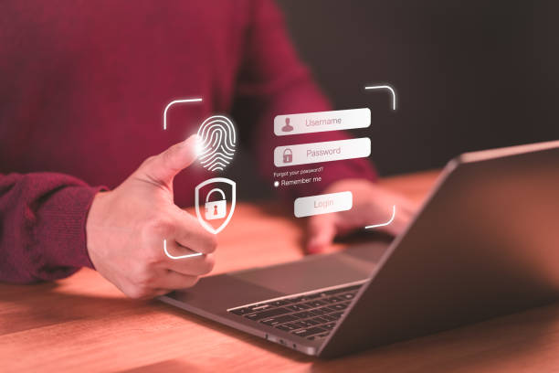 istock User man login or sign in with fingerprint scanning technology in the computer laptop. Secure encryption and access to the user's private information to access the internet. 1873389637