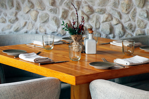 standard dining table set up for the restaurant with wooden furniture