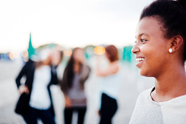 istock Young african woman having fun with friends 187340298
