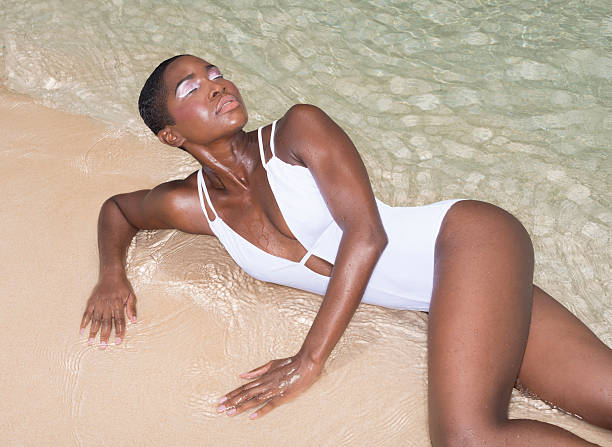 istock Young Woman At The Beach 187340513