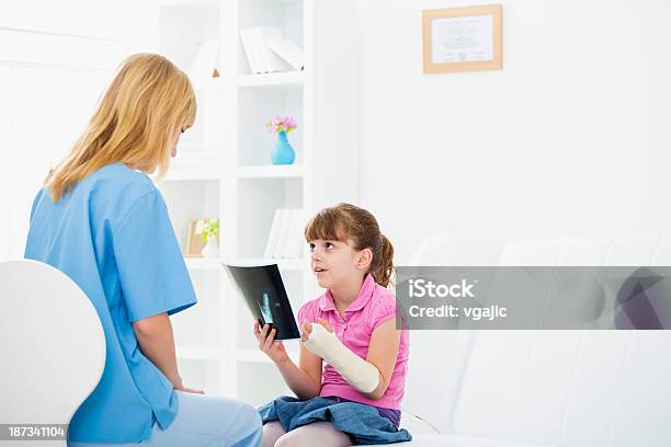 Girl With Broken Arm At Doctors Office Stock Photo - Download Image Now - 25-29 Years, 6-7 Years, Adult