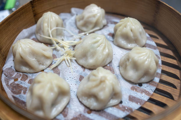 istock steamed dumplings in bamboo steamer, chinese cuisine 1873421497