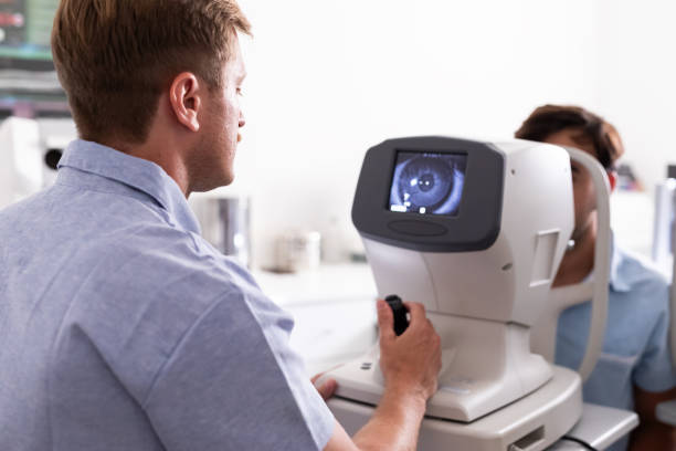 istock Ophthalmologist examining patient in his office 1873436741