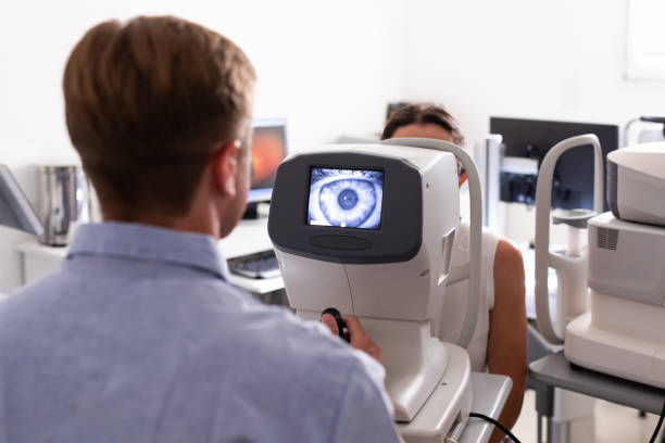 istock Ophthalmologist examining patient in his office 1873436743