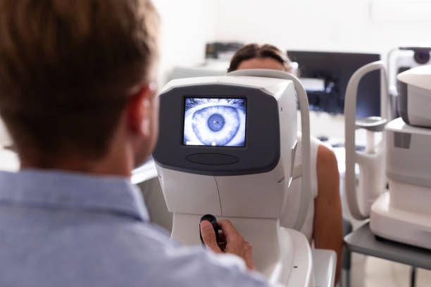 istock Ophthalmologist examining patient in his office 1873443419