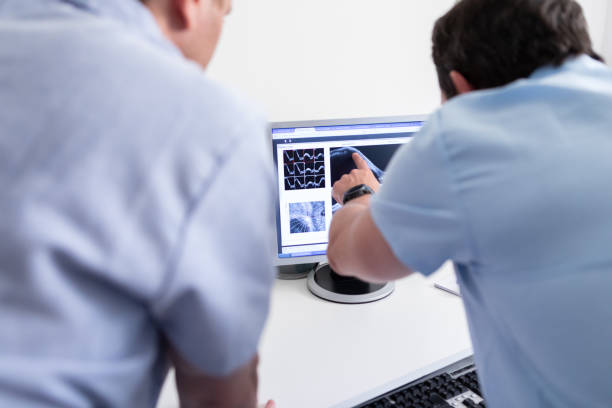 istock Ophthalmologist colleagues analyzing the result of a patient 1873443466
