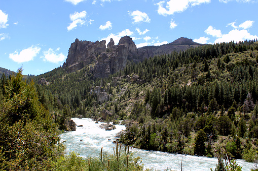 Caleufu river and beautiful rock formations on background, Neuquen, Argentina.