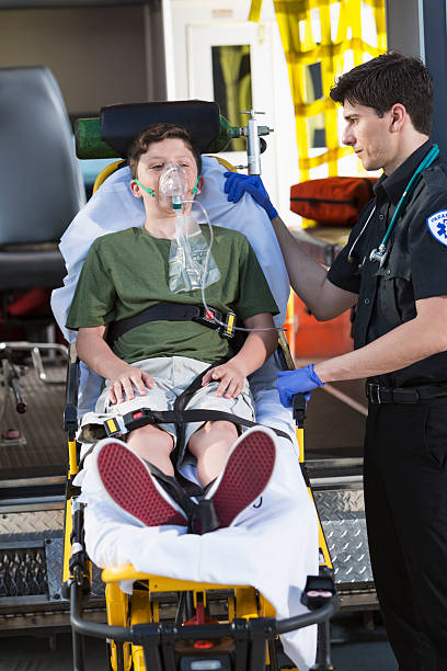 istock Paramedic with child on stretcher 187344974