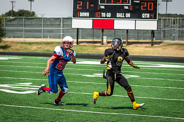 istock Football play in progress - IX 187345036