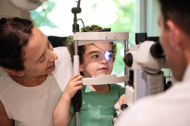 istock Ophthalmologist examining the vision of a small child 1873453746