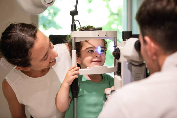 istock Ophthalmologist examining the vision of a small child 1873453748