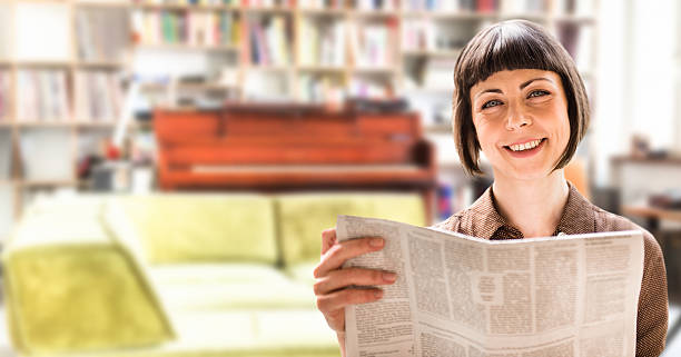 istock reading a newspaper on the living room 187345622