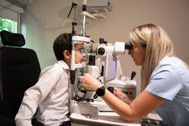 istock Ophthalmologist examining the vision of a small child 1873457748