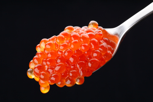 Spoon with red caviar