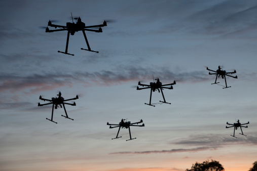 Hexacopter drones flying in the evening