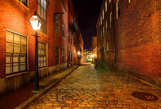 istock Dark Cobblestone Alleyway 187347917