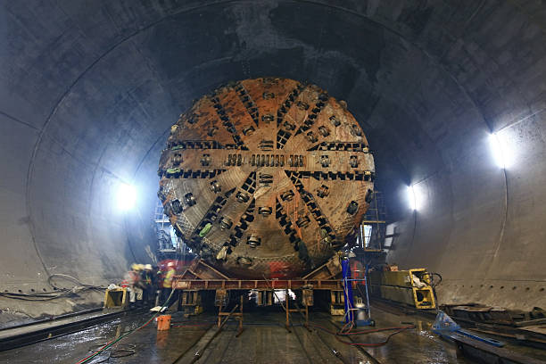 Tunnel Boring Machine Tunnel Boring Machine (TBM) )that is being moved inside an underground tunnel.  tunnel photos stock pictures, royalty-free photos & images