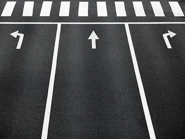 istock Empty road with arrow signs and cross walk 187348544