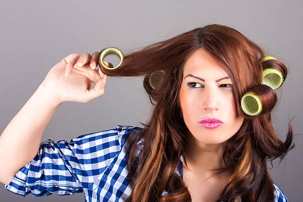 istock girl with curlers 187349711