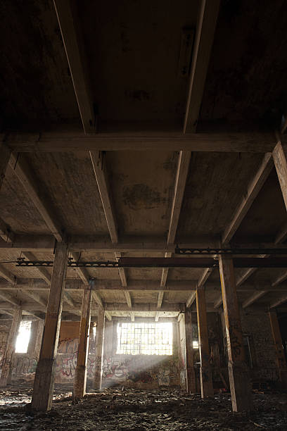 istock Abandoned building with light coming by the window 187351179