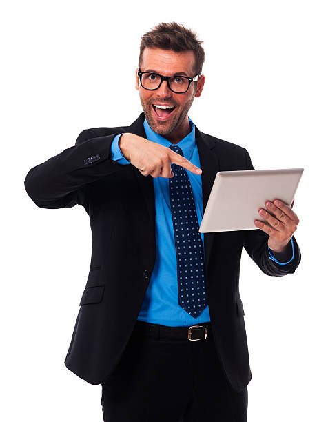 istock Shocked businessman showing on digital tablet 187352202