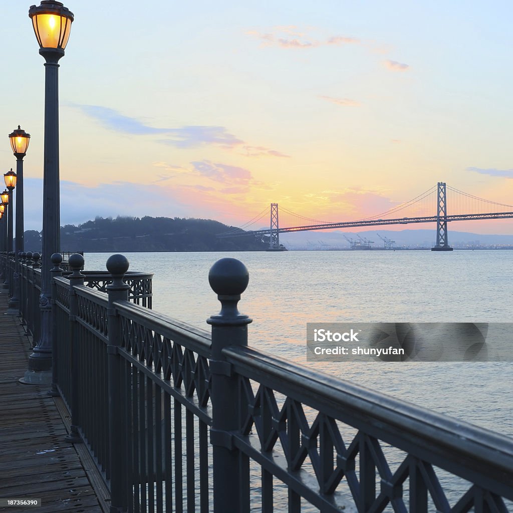 San Francisco: Bay Bridge from Embarcadero Bay bridge at night at San Francisco.. Bridge - Built Structure Stock Photo