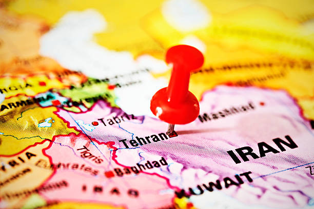 Tehran marked by red pushpin on Middle East map A red pushpin is stuck into Tehran on a map of part of the Middle East. euphrates syria stock pictures, royalty-free photos & images