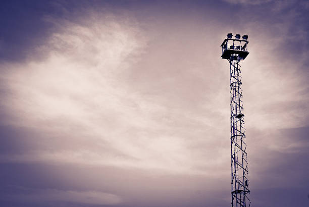 istock High power electrical lights on a cloudy day with silhouette 187356803