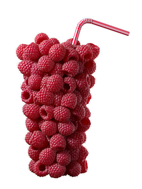 raspberries in glass shape with straw on white stock photo