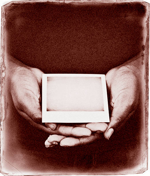 Female Hands Holding Blank Photograph