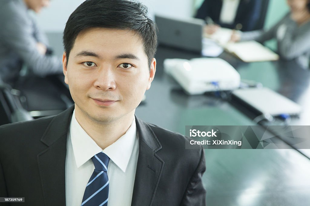 Businessman in Board Room Identity Stock Photo