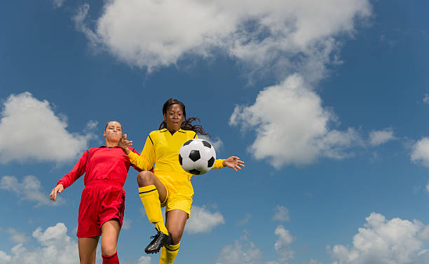 istock Young Women Playing Football 187359804