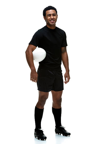 istock Sportsman standing with rugby ball 187360031