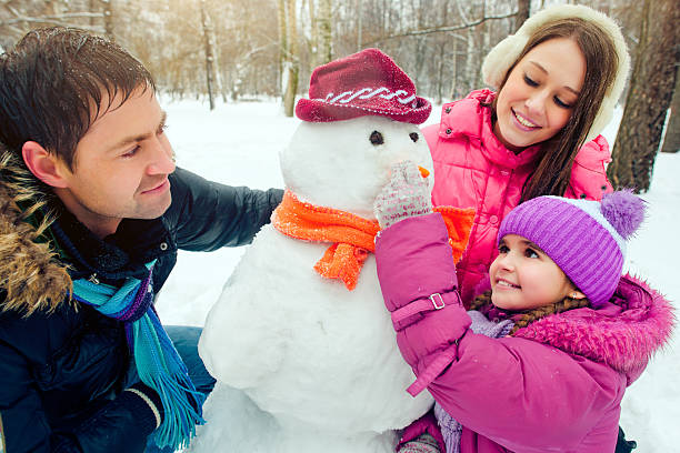 istock Family in a winter park 187360659