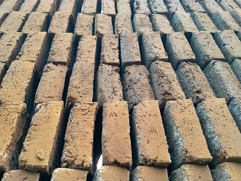 A pile of bricks in the natural drying process before firing