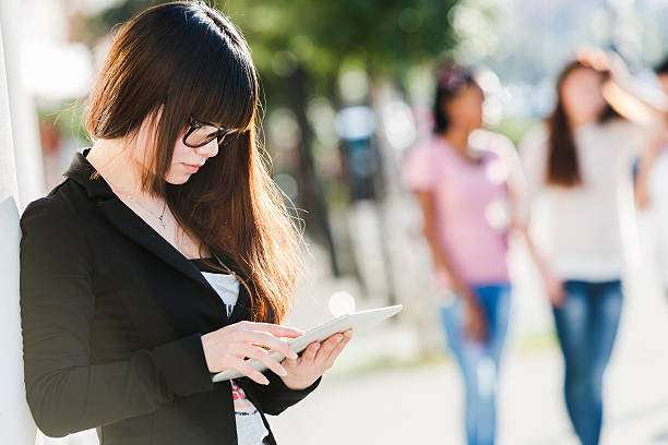 istock Chinese business woman using digital tablet 187362497