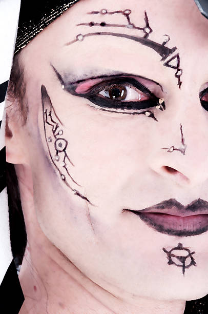 istock Full frame high contrast closeup of man in cyborg makeup. 187362529