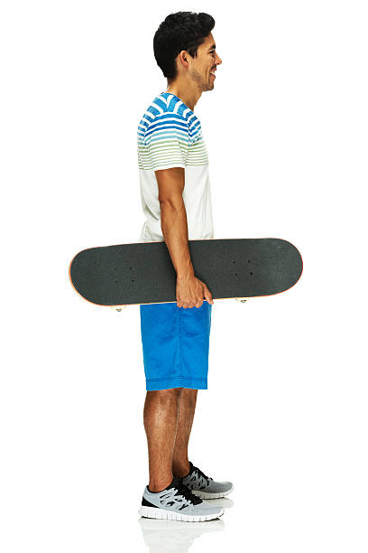 istock Sportsman standing with skateboard 187363336