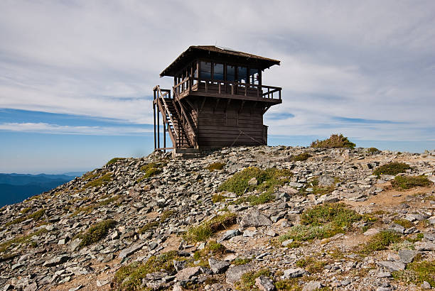 Historic Mount Fremont Fire Lookout The Mount Fremont Fire Lookout is a rustic style building in the northern part of Mount Rainier National Park. It sits on top of a rocky outcrop at an elevation of 7317 feet above sea level. The building is maintained as a historic structure and is no longer used as a fire lookout. The lookout was placed on the National Register of Historic Places on March 13, 1991. Mount Fremont Lookout is located near Sunrise in Mount Rainier National Park, Washington State, USA. jeff goulden government building stock pictures, royalty-free photos & images
