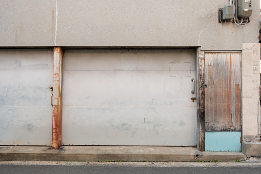 Close-up on part of an old two car garage.