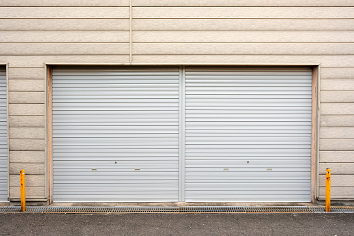 Close-up on a closed silver garage door.