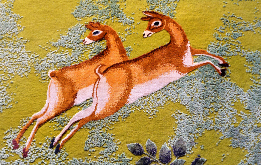 Close-up view of animals design on rugs