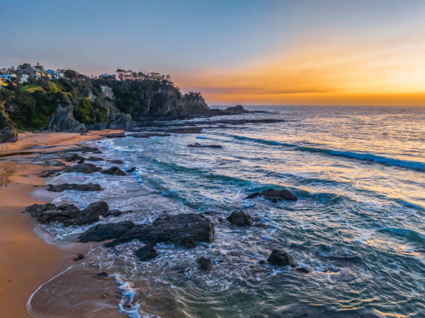 istock Sunrise seascape with high clouds 1873670800
