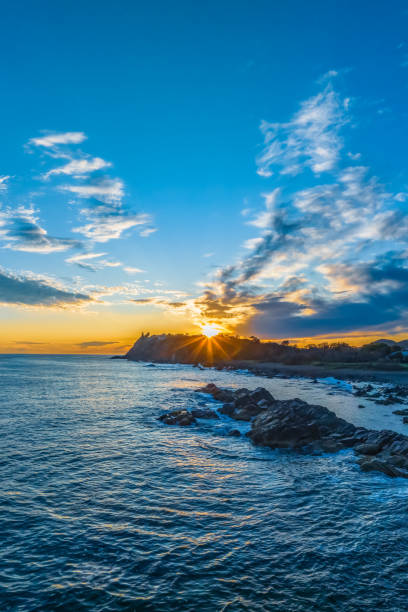 istock Coastal Sunrise with Rock Formations 1873671311